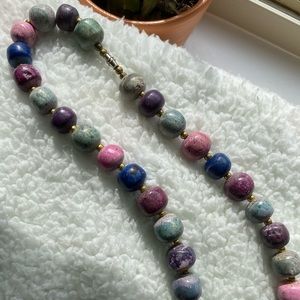 Marble like necklace with gold beads